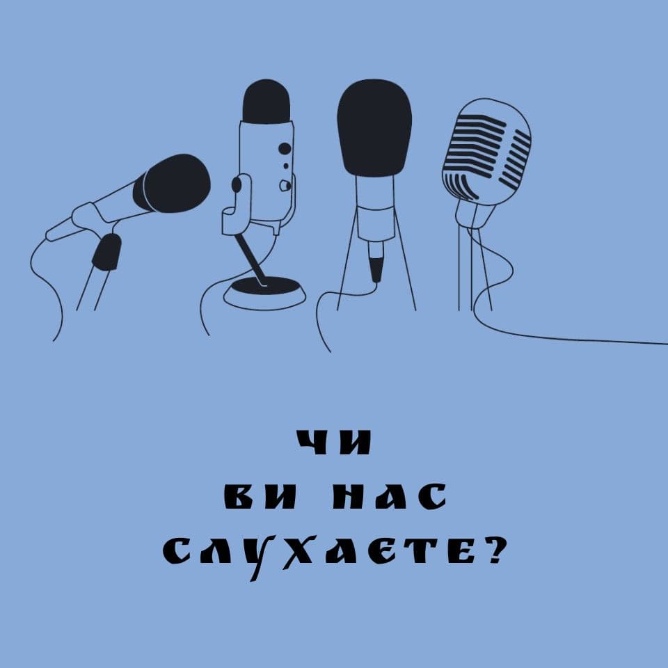 A blue background with three microphones and a microphone stand