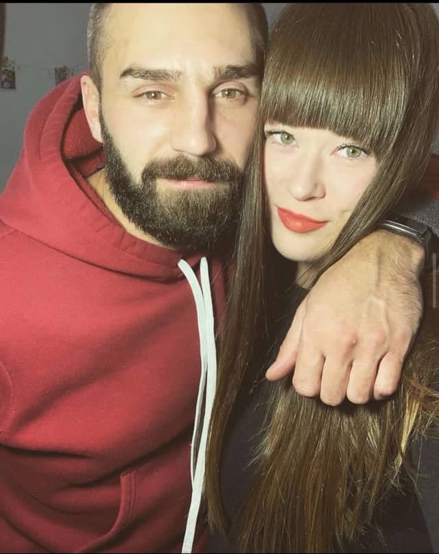 A man and a woman posing for a picture