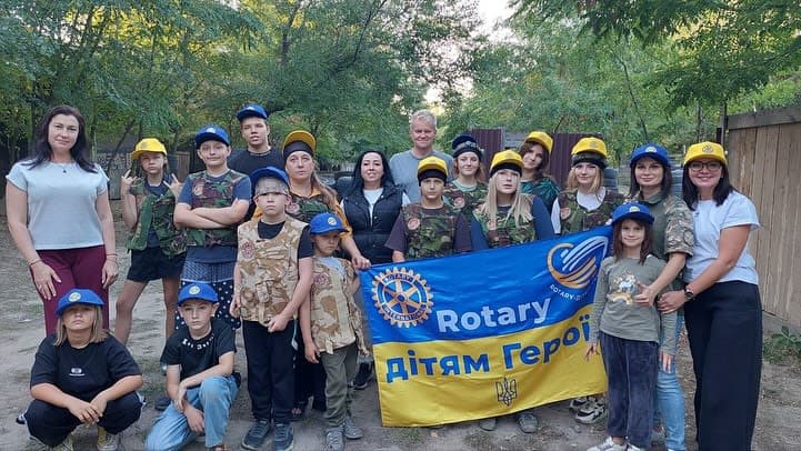 A group of people standing next to each other