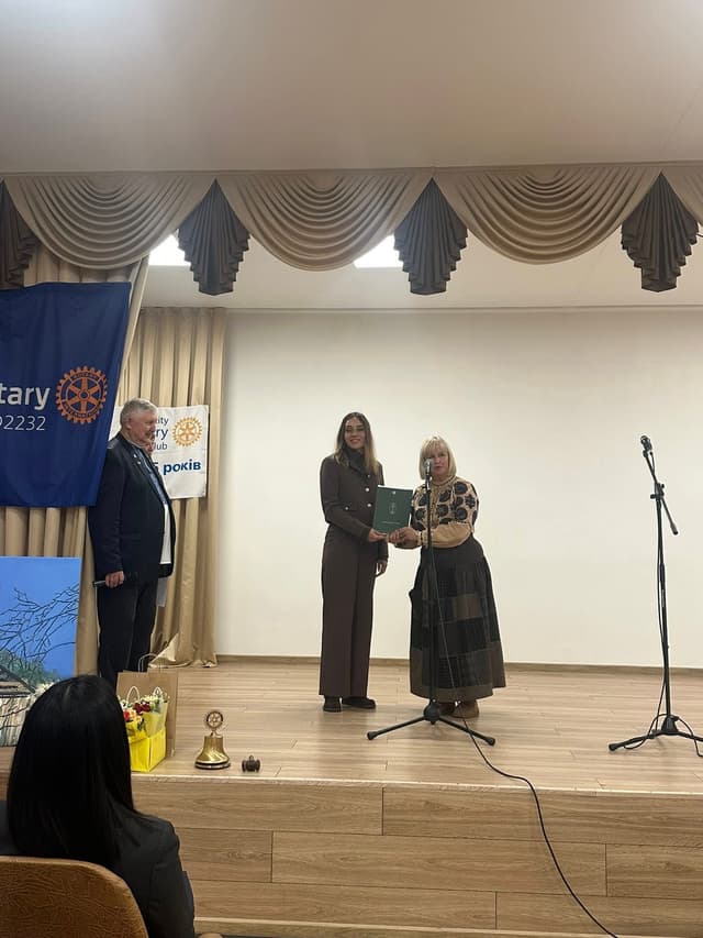 A group of people standing on top of a stage