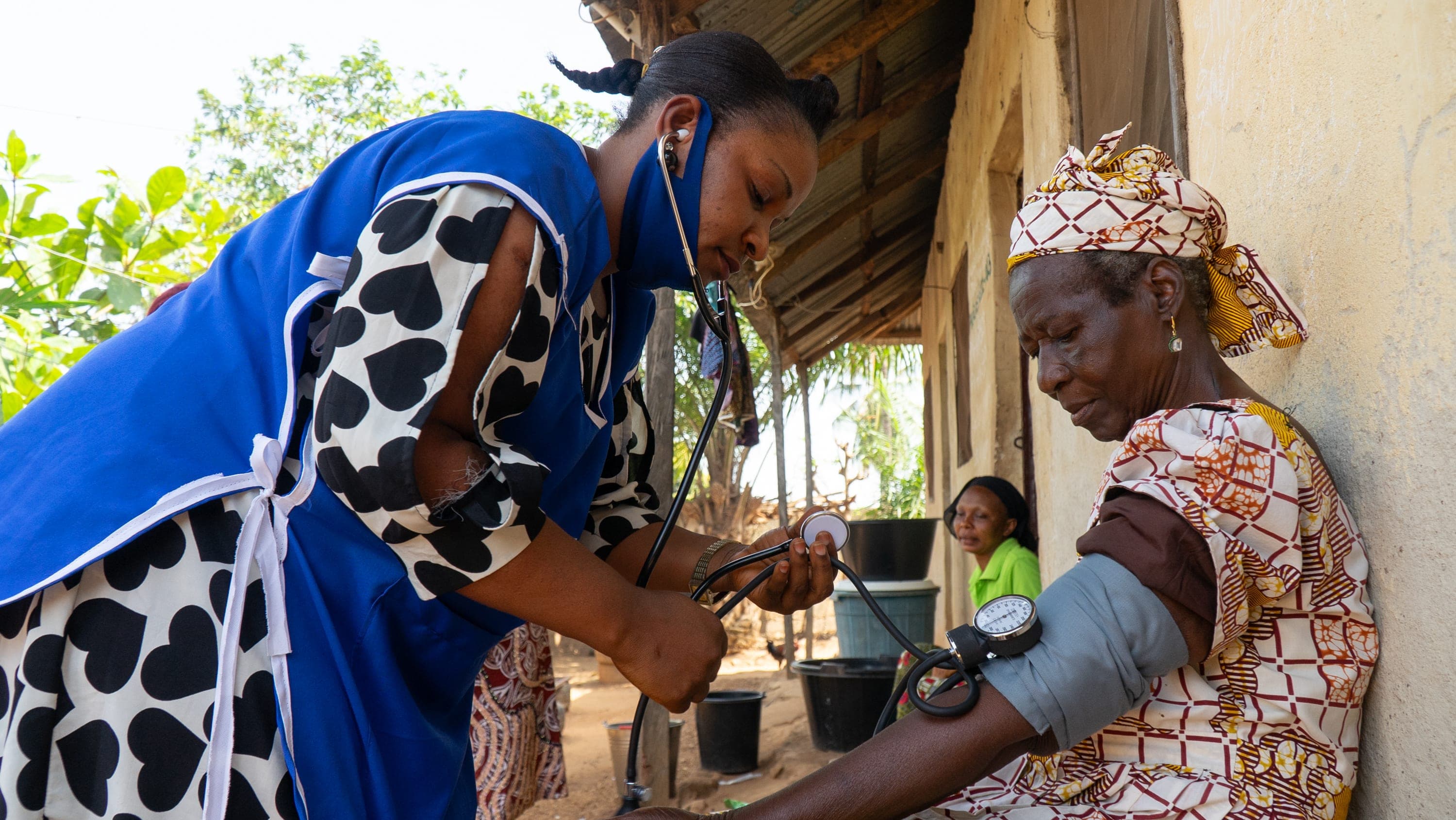 A couple of women standing next to each other