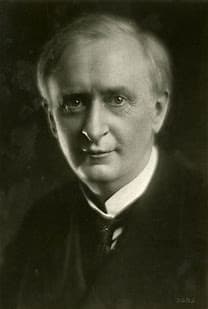 A black and white photo of a man in a suit