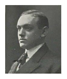 A black and white photo of a man in a suit