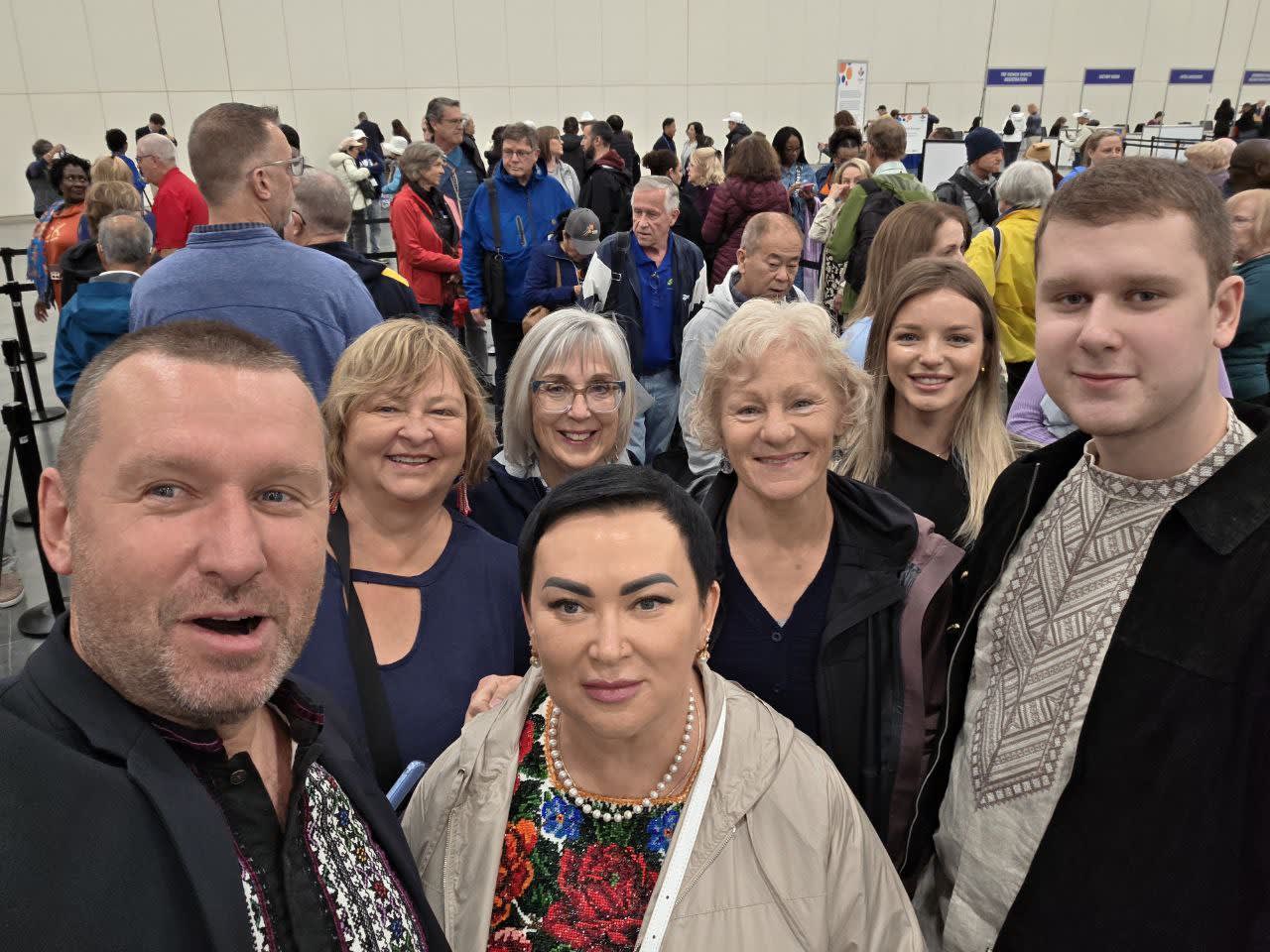 A group of people standing next to each other