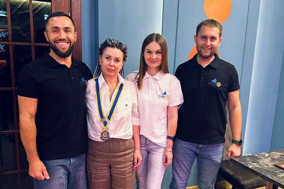 A group of people standing next to each other