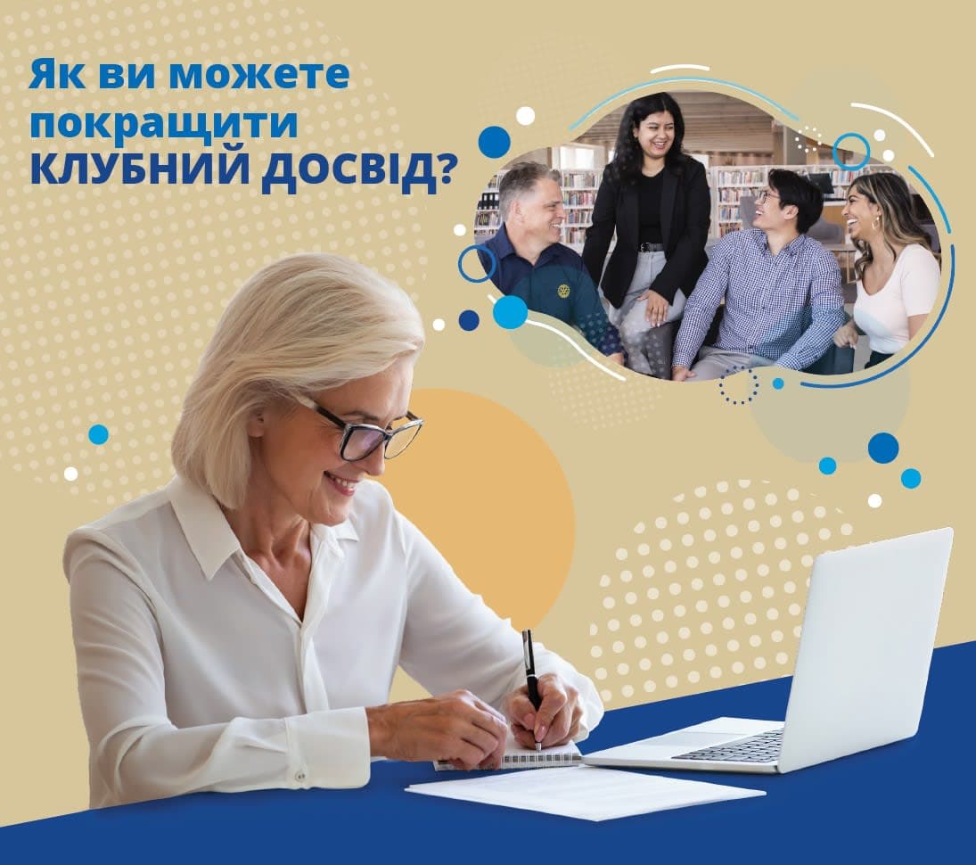 A woman sitting at a table with a laptop computer