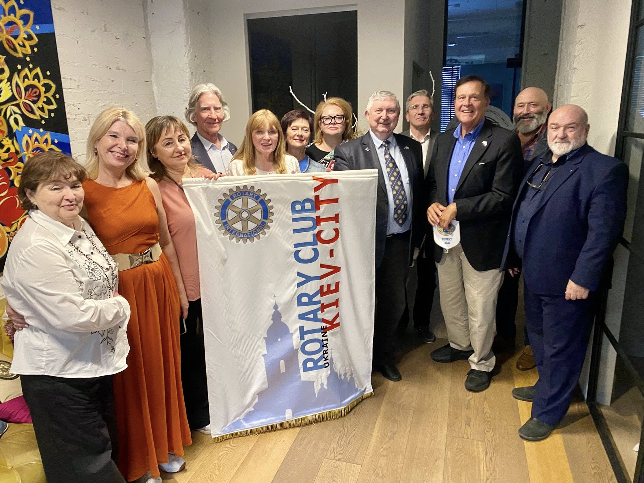 A group of people posing for a picture with a rotary rotary rotary rotary rotary rotary