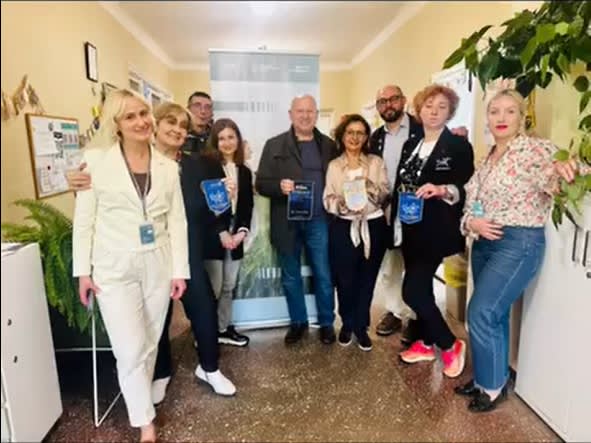 A group of people standing next to each other