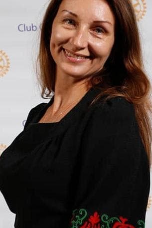 A woman with a smile on her face