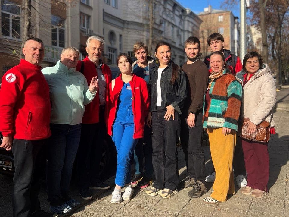 A group of people standing next to each other