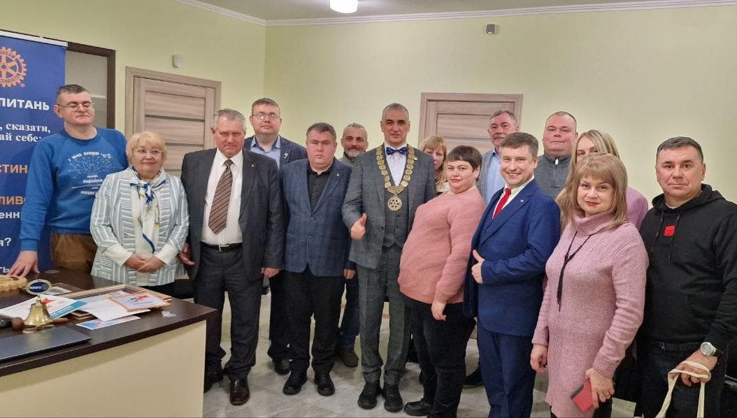 A group of people standing next to each other