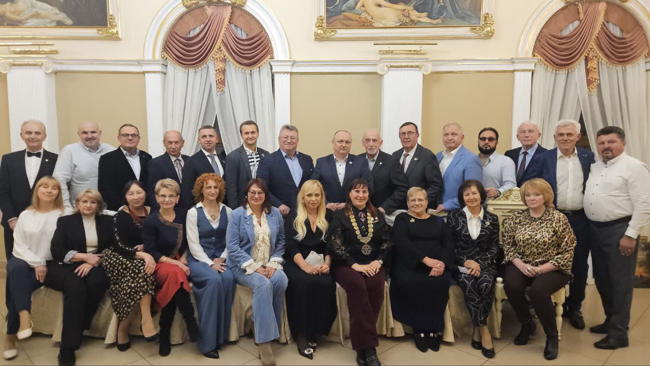 A group of people in suits and ties posing for a picture