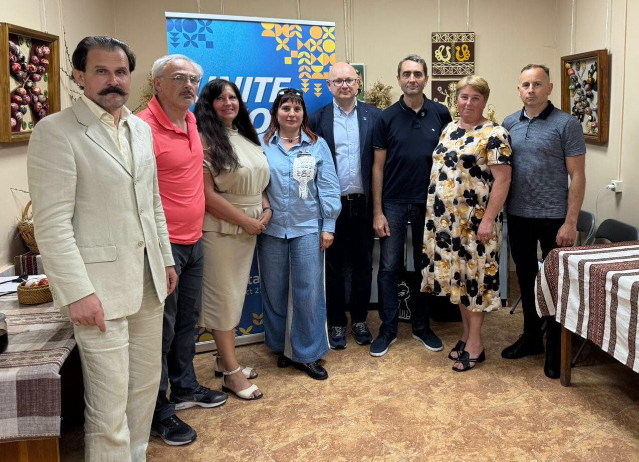 A group of people standing next to each other