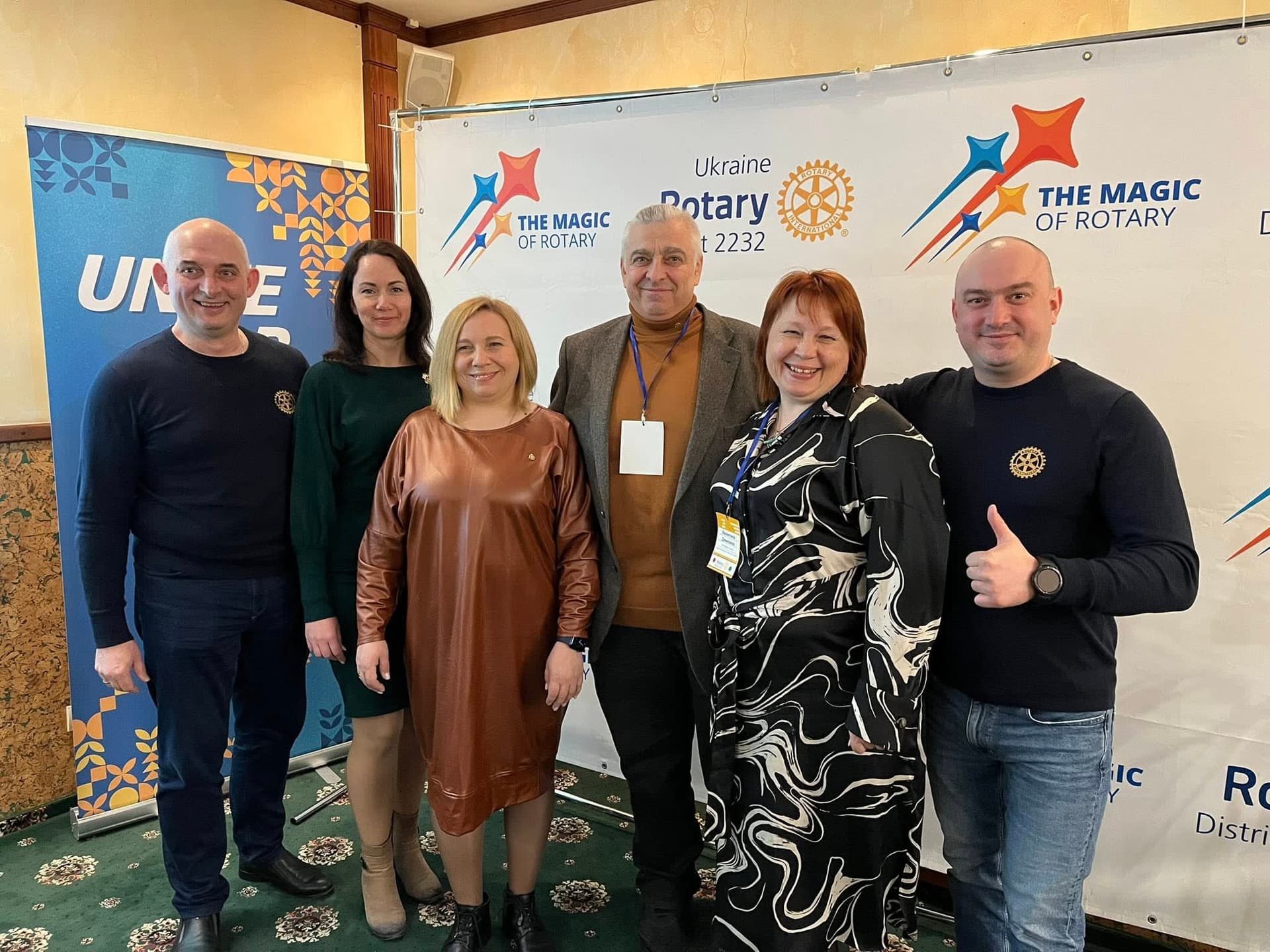 A group of people standing next to each other