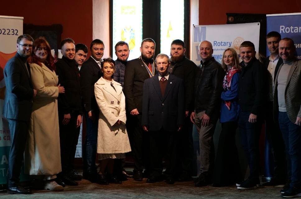 A group of people standing next to each other