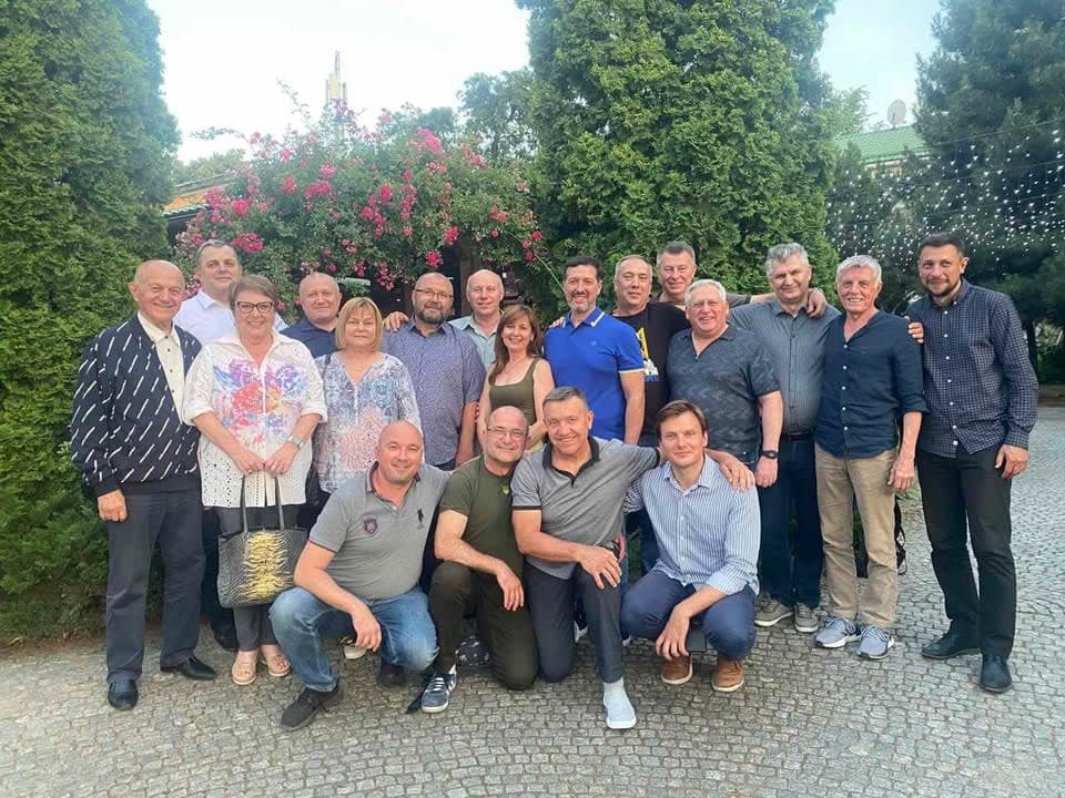 A group of people standing next to each other