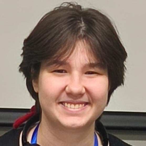 A woman with a medal around her neck