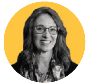 A black and white photo of a woman wearing glasses