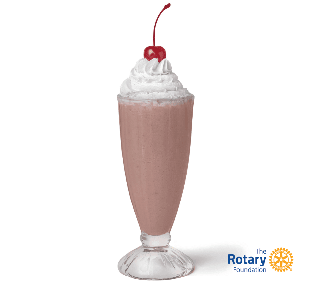 A drink with whipped cream and a cherry on top